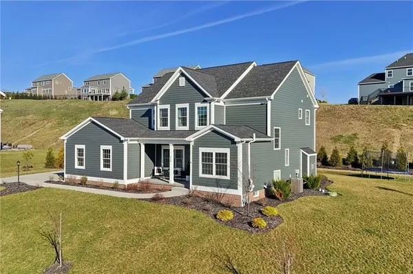 a front view of a house with a yard