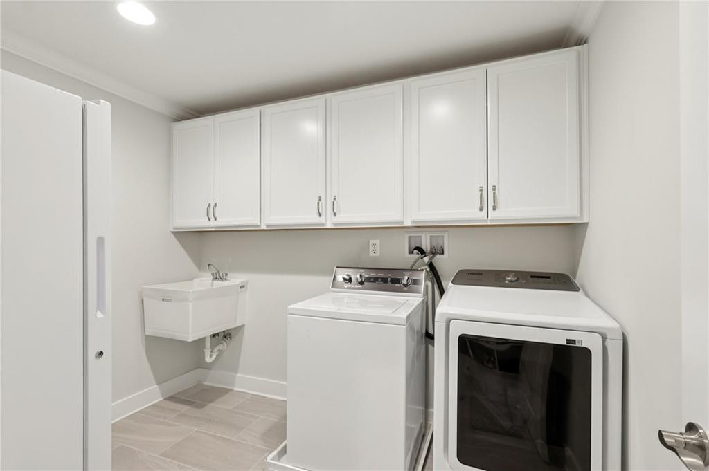 216 Hickory Lane Mars, PA 16046 - Photo 21 of 50 a utility room with sink dryer and washer