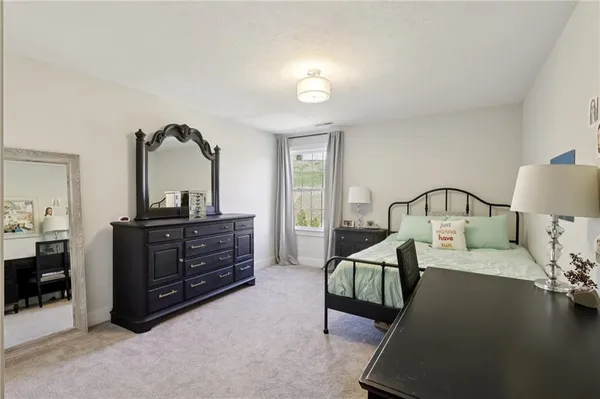 a bedroom with a bed and furniture