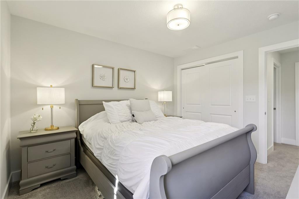 216 Hickory Lane Mars, PA 16046 - Photo 33 of 50 a bedroom with a bed and a lamp on dresser