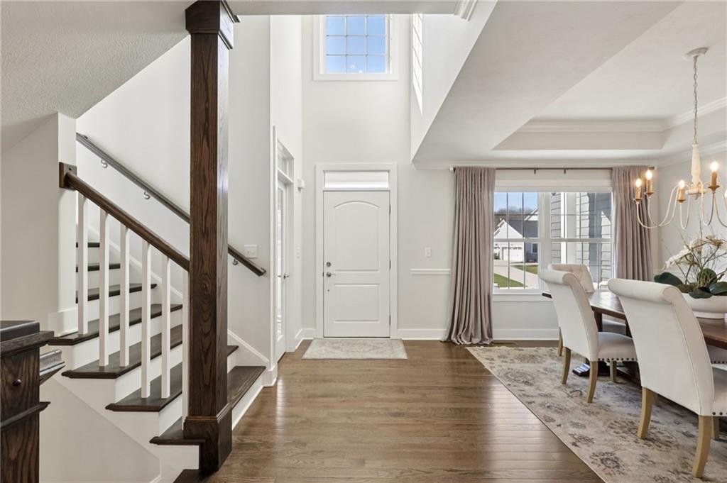 216 Hickory Lane Mars, PA 16046 - Photo 4 of 50 a view of a hallway with wooden floor and staircase