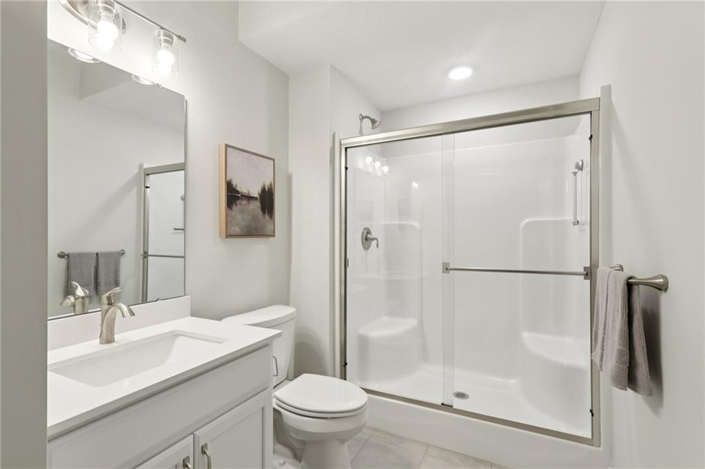 216 Hickory Lane Mars, PA 16046 - Photo 41 of 50 a bathroom with a shower sink vanity mirror and toilet
