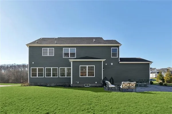 a front view of house with a garden