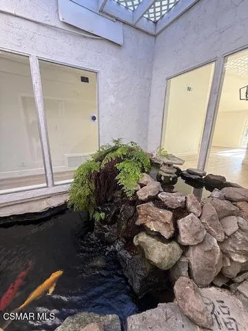 a vase of flowers sitting on a floor