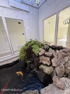 a vase of flowers sitting on a floor