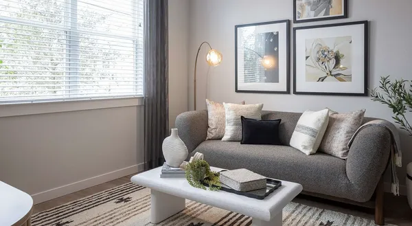 a living room with furniture and a window