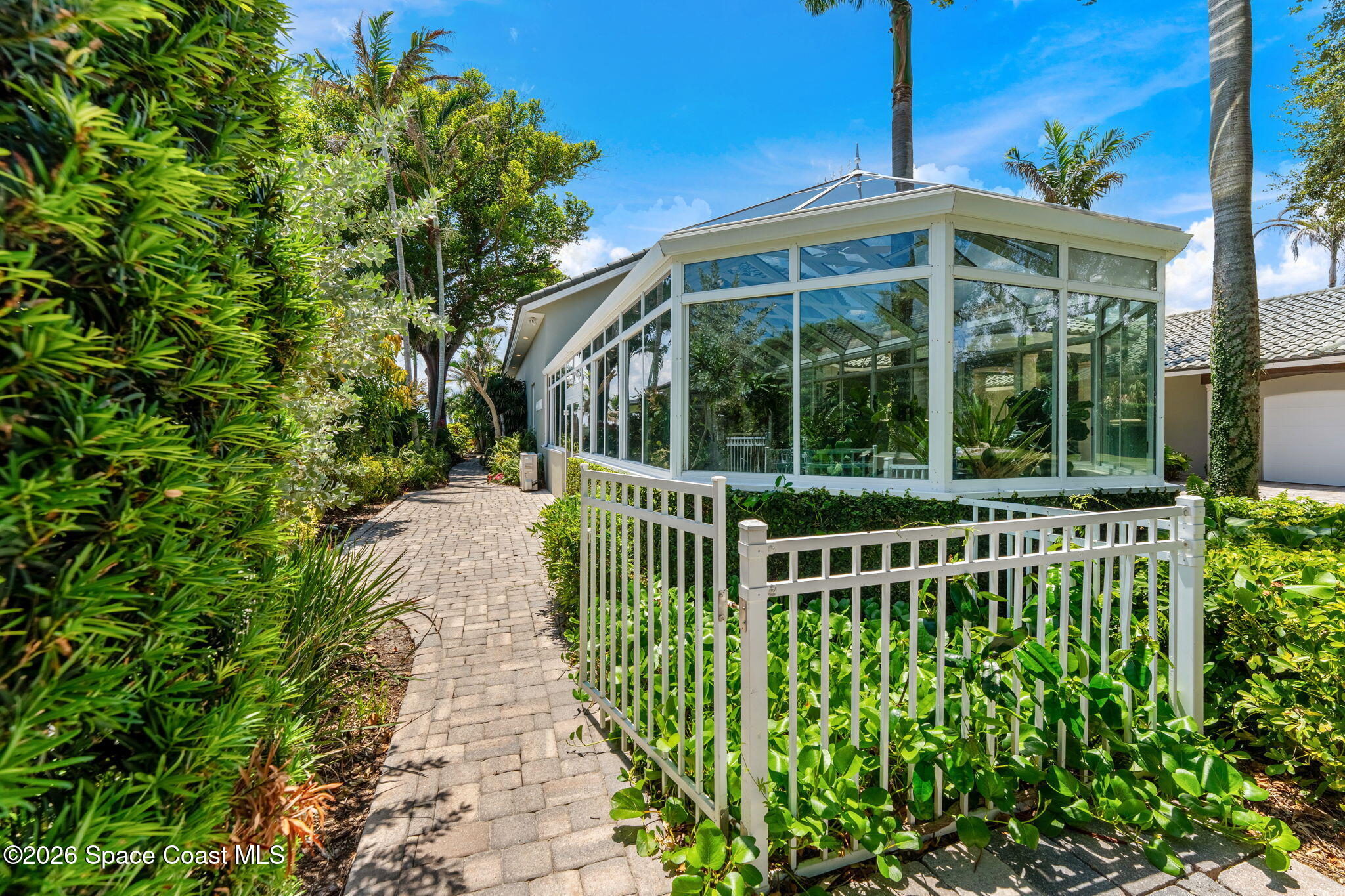 200 Riverside Drive Melbourne Beach, FL 32951 - Photo 83 of 103 Entry to Side Garden