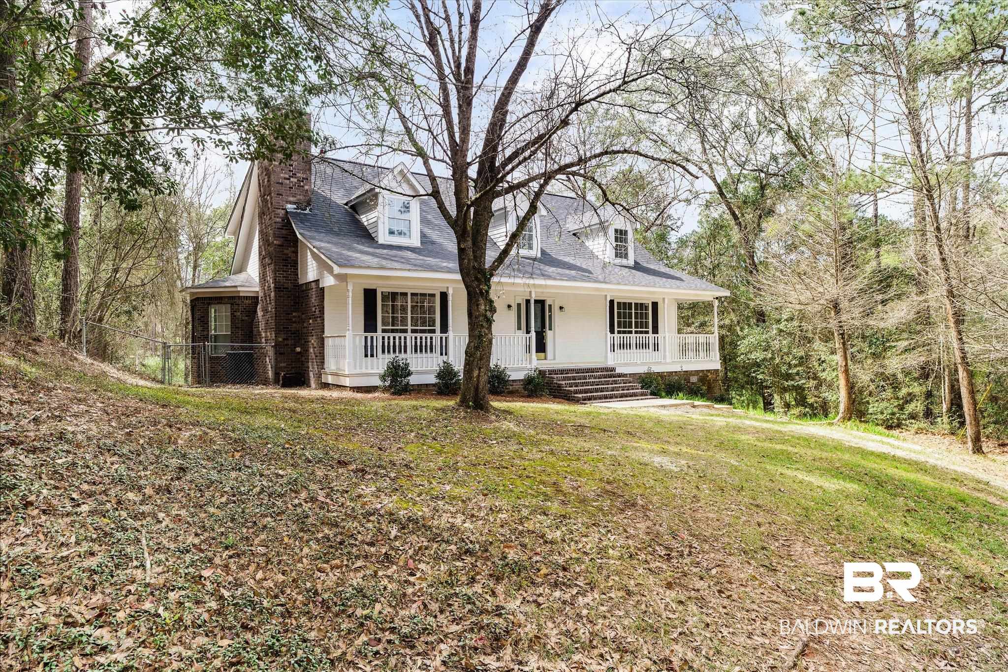 106 Melanie Loop Daphne, AL 36526 - Photo 41 of 45 Cape cod home with a porch, a front yard, a chimney, and roof with shingles