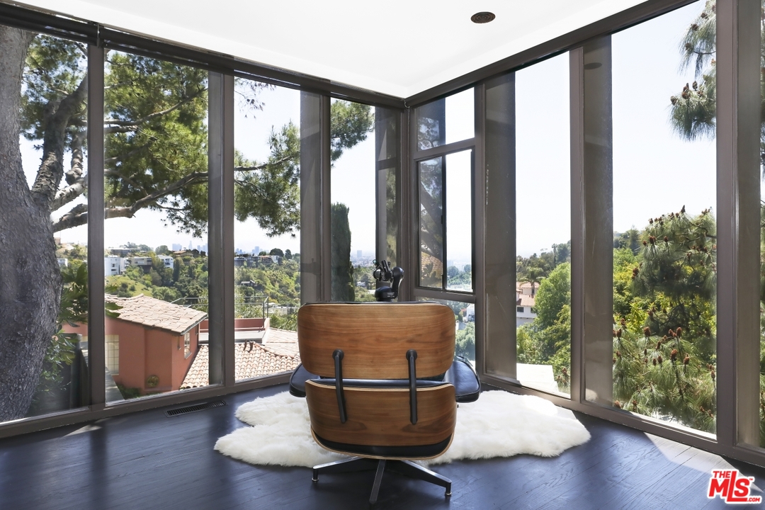 2867 Belden Drive Los Angeles, CA 90068 - Photo 15 of 54 a living room with a floor to ceiling window and wooden floor