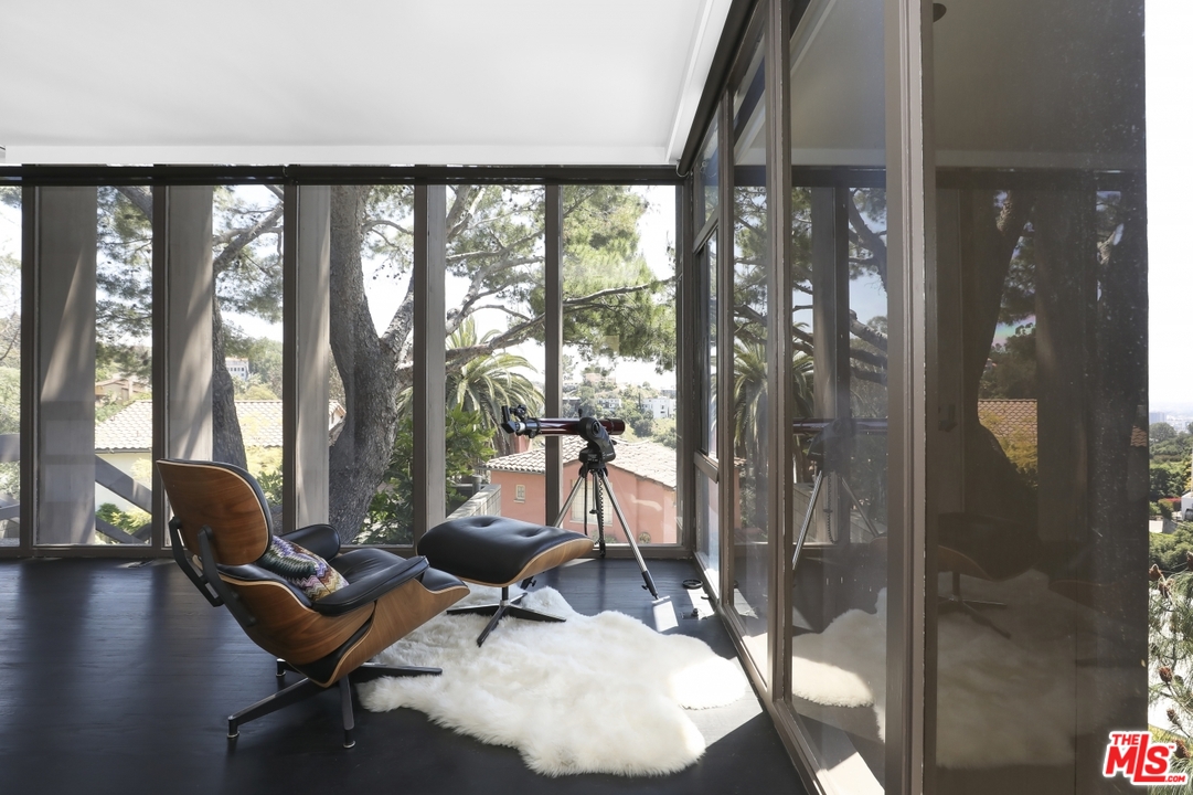 2867 Belden Drive Los Angeles, CA 90068 - Photo 16 of 54 a living room with furniture and floor to ceiling windows