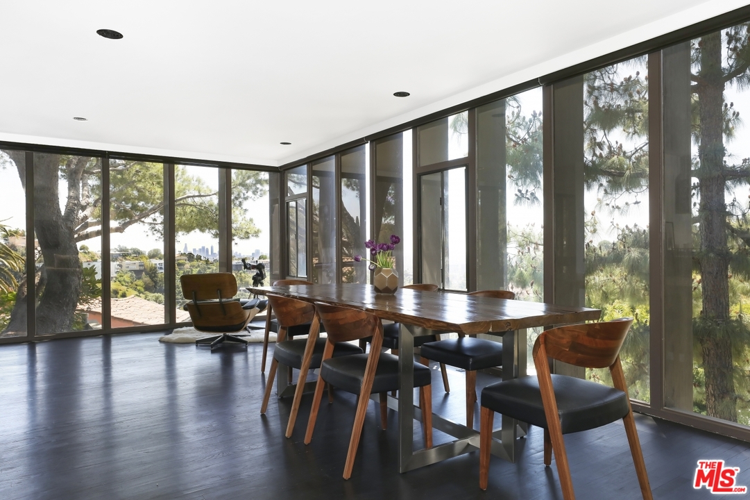 2867 Belden Drive Los Angeles, CA 90068 - Photo 17 of 54 a living room with furniture and floor to ceiling windows