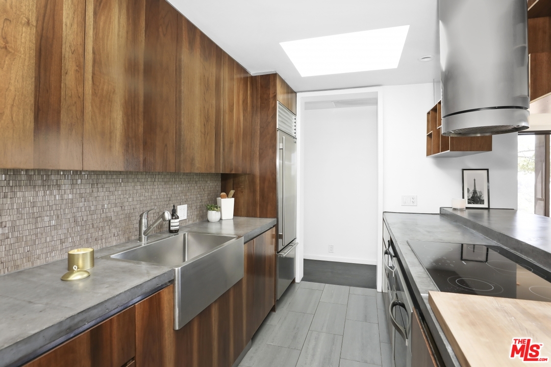 2867 Belden Drive Los Angeles, CA 90068 - Photo 25 of 54 a kitchen with a sink cabinets and stainless steel appliances