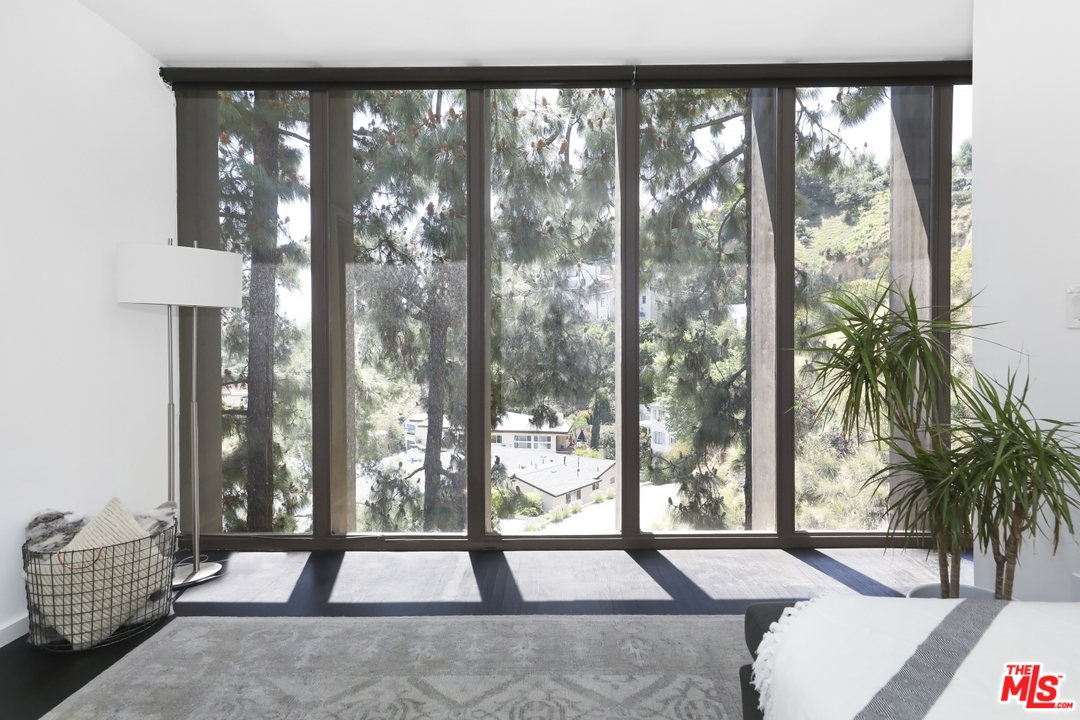 2867 Belden Drive Los Angeles, CA 90068 - Photo 29 of 54 a view of a room with gym equipment and floor to ceiling window