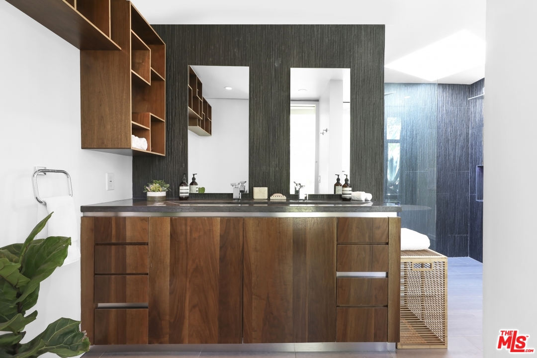 2867 Belden Drive Los Angeles, CA 90068 - Photo 34 of 54 a bathroom with a granite countertop sink and a mirror