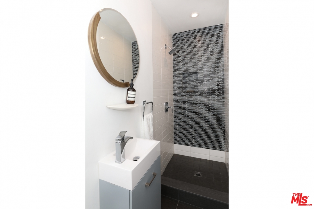 2867 Belden Drive Los Angeles, CA 90068 - Photo 45 of 54 a bathroom with a sink and a mirror