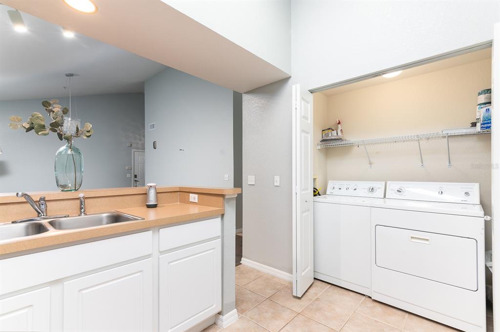 4850 Southwest 91 Terrace, Unit 301 Gainesville, FL 32608 - Photo 9 of 24 a utility room with dryer and washer