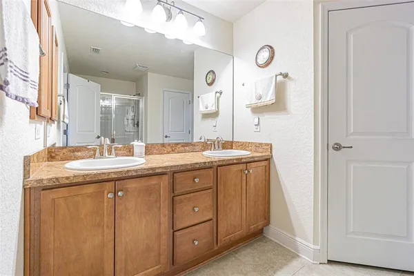 a bathroom with a granite countertop sink mirror and a