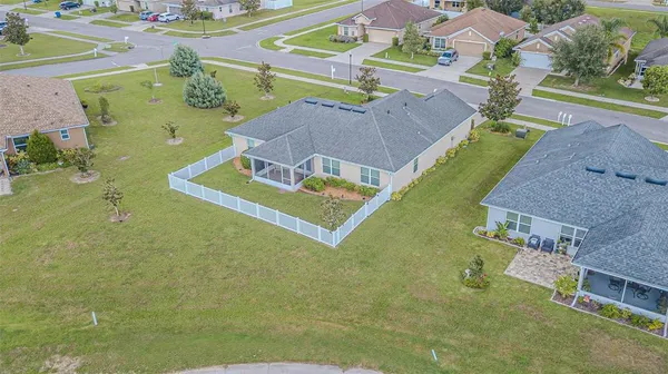 an aerial view of a house with a swimming pool