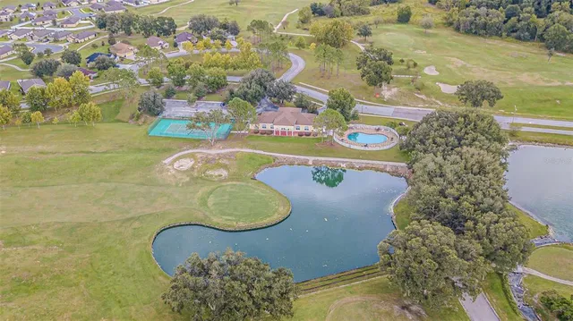 a bathroom with a sink mirror and bathtub