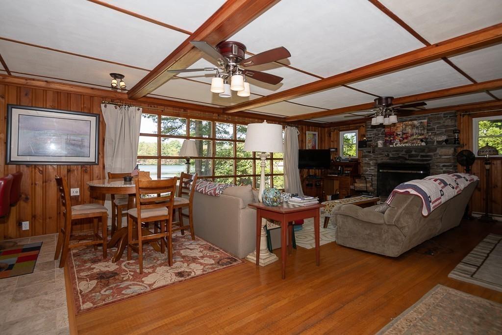 3 Lakeview Road Webster, MA 01570 - Photo 11 of 40 a living room with fireplace furniture and a large window
