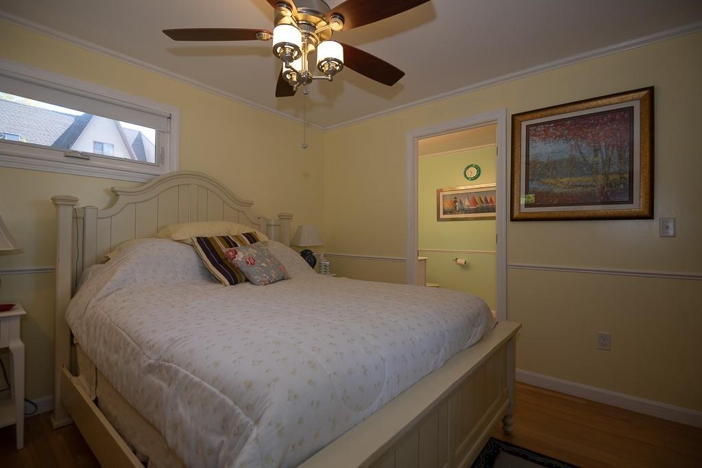 3 Lakeview Road Webster, MA 01570 - Photo 16 of 40 a bedroom with a bed and a chandelier