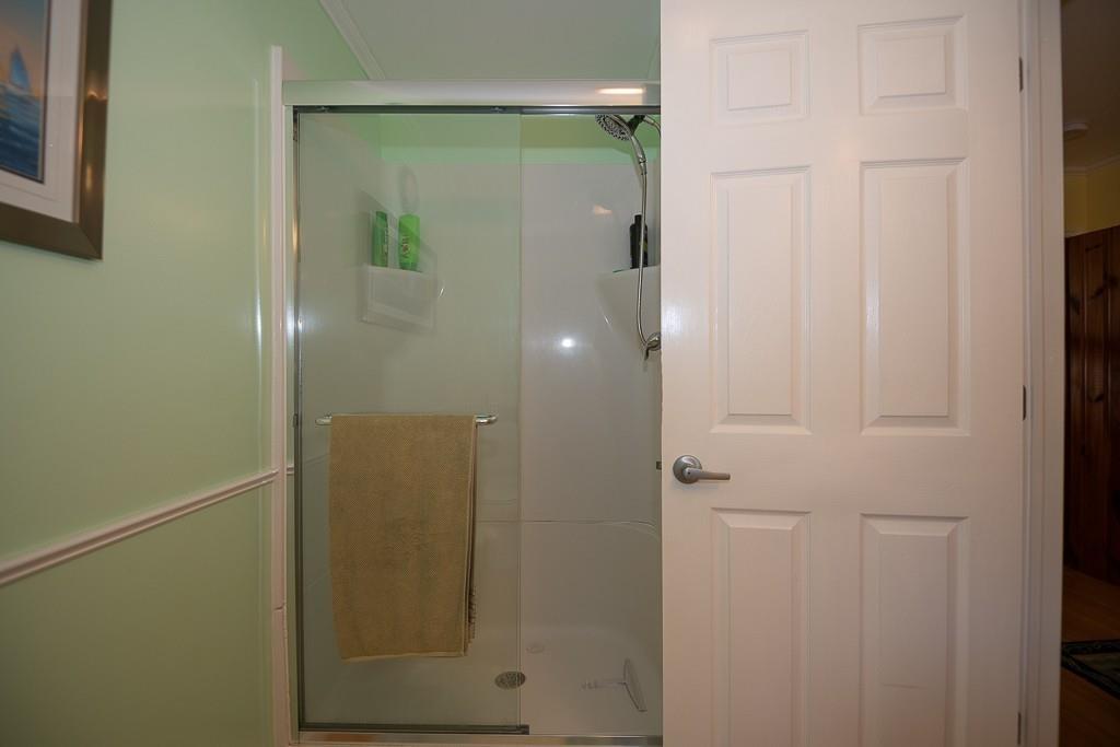 3 Lakeview Road Webster, MA 01570 - Photo 18 of 40 a bathroom with a glass shower door