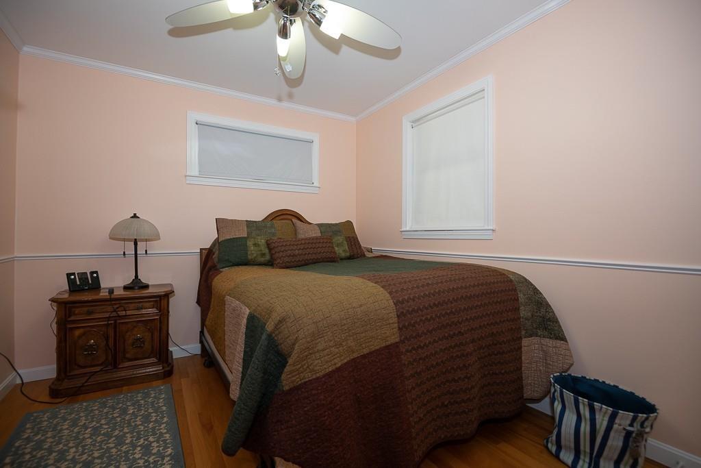 3 Lakeview Road Webster, MA 01570 - Photo 19 of 40 a bedroom with a bed and wooden floor