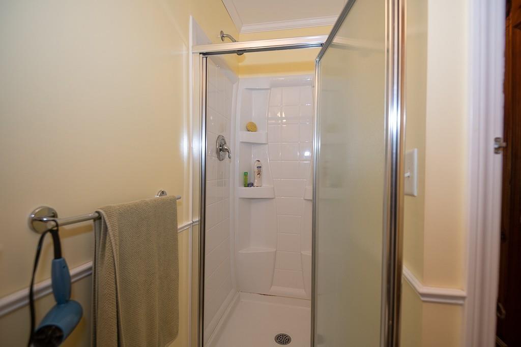 3 Lakeview Road Webster, MA 01570 - Photo 22 of 40 a bathroom with a glass shower door and mirror