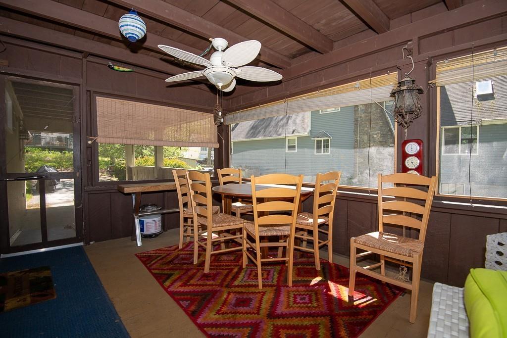 3 Lakeview Road Webster, MA 01570 - Photo 25 of 40 a view of a dining room with furniture wooden floor and chandelier