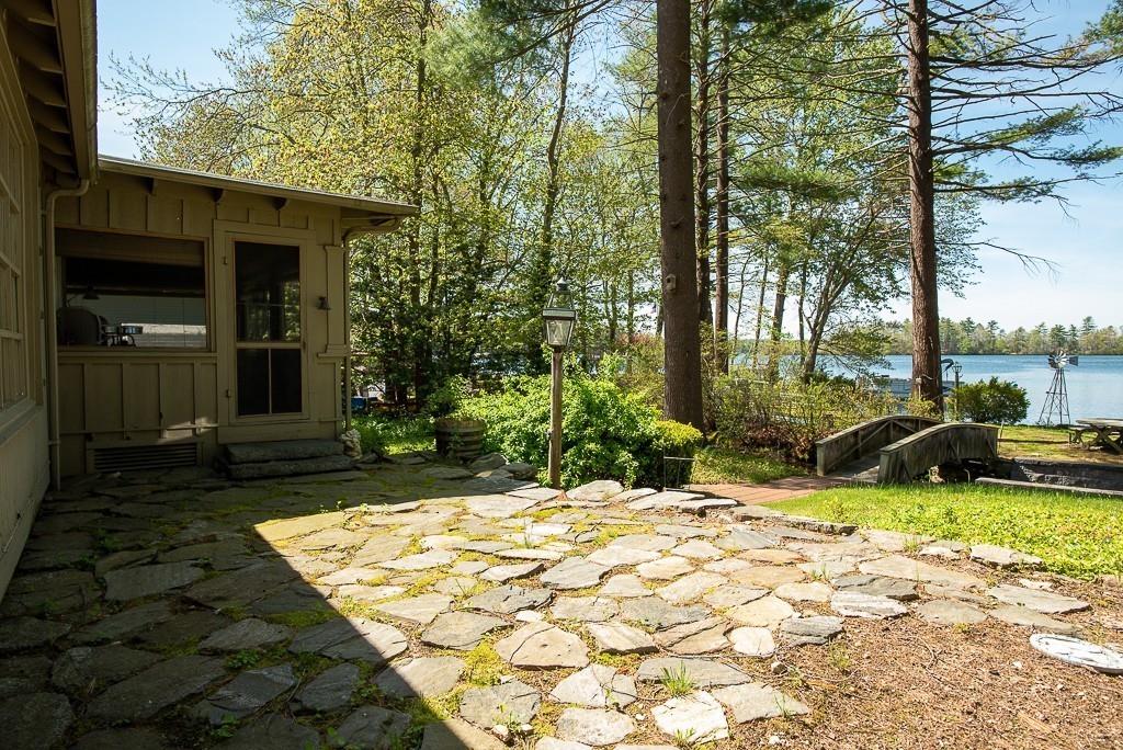 3 Lakeview Road Webster, MA 01570 - Photo 29 of 40 a view of a house with backyard porch and sitting area