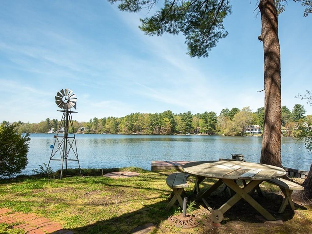 3 Lakeview Road Webster, MA 01570 - Photo 3 of 40 a view of a lake with lawn chairs