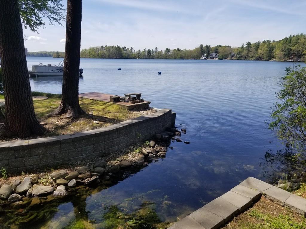 3 Lakeview Road Webster, MA 01570 - Photo 31 of 40 a view of a lake with a floor to ceiling window next to a road and lake
