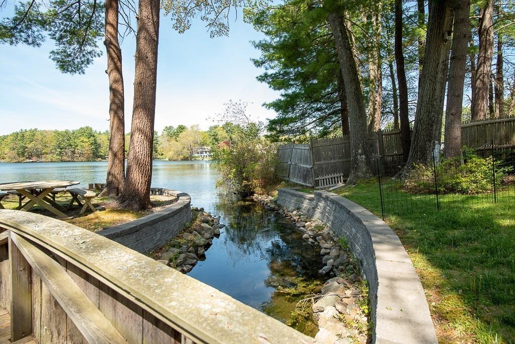 3 Lakeview Road Webster, MA 01570 - Photo 32 of 40 a view of a lake with a garden