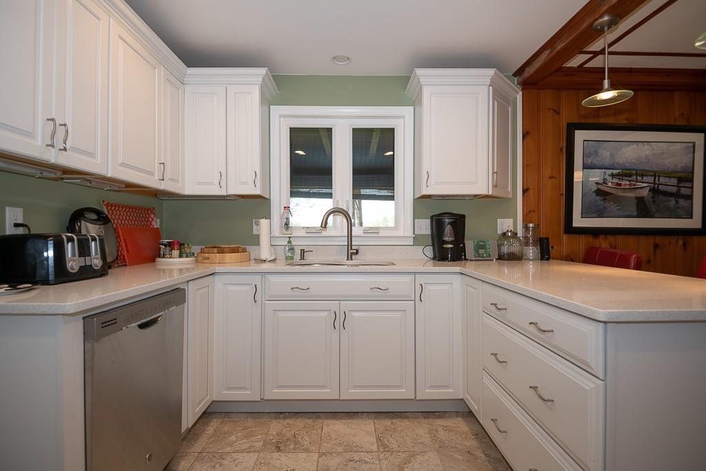 3 Lakeview Road Webster, MA 01570 - Photo 6 of 40 a kitchen with white cabinets and sink