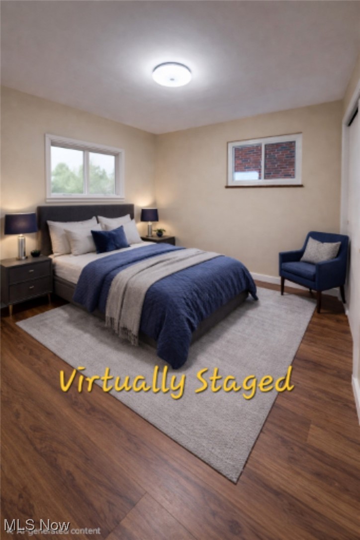 6660 State Road Parma, OH 44134 - Photo 11 of 25 Staged Bedroom with dark wood-type flooring and baseboards