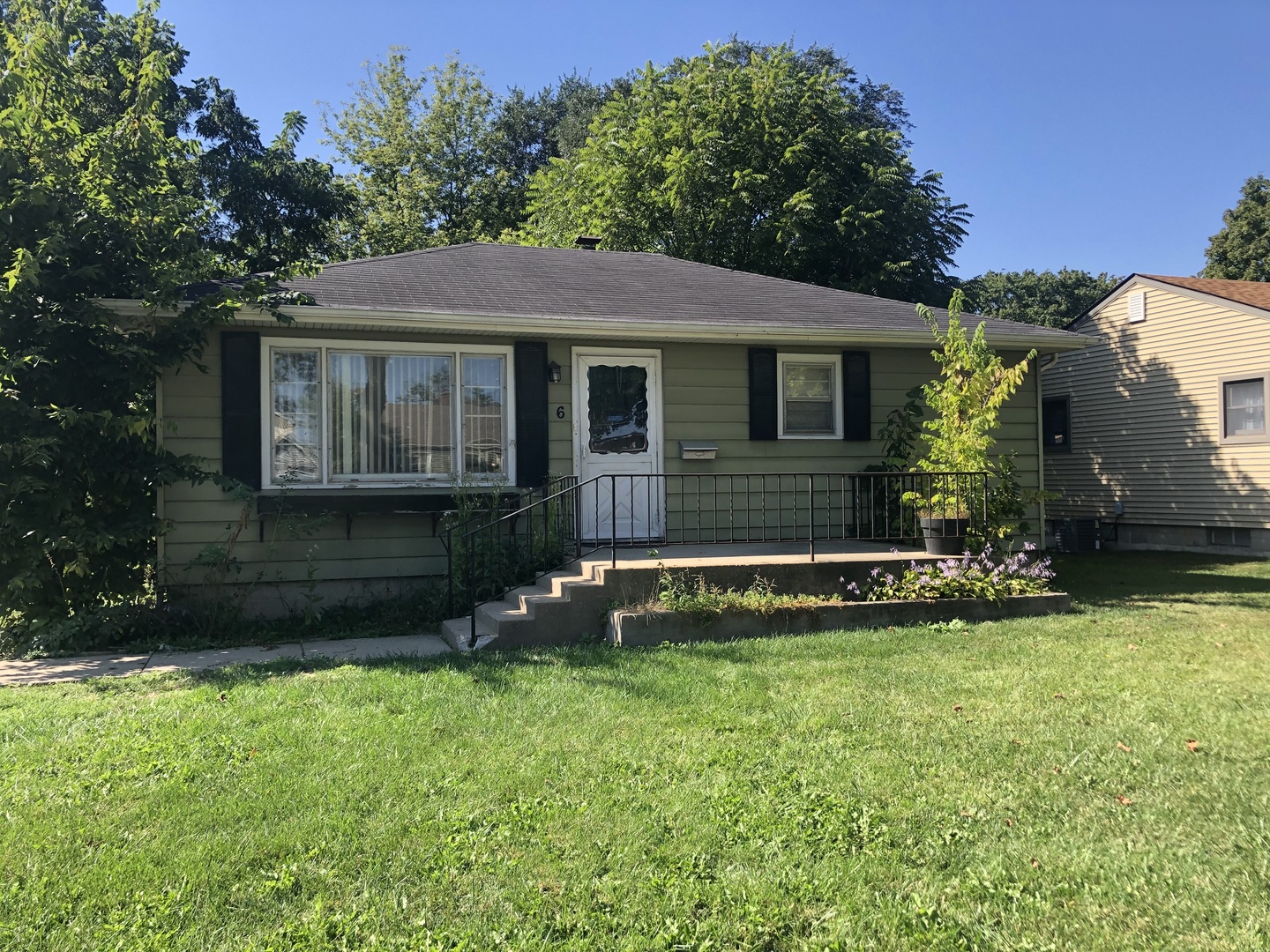 6 North Adams Street, Unit 6 North Aurora, IL 60542 - Photo 1 of 1 a front view of a house with a yard