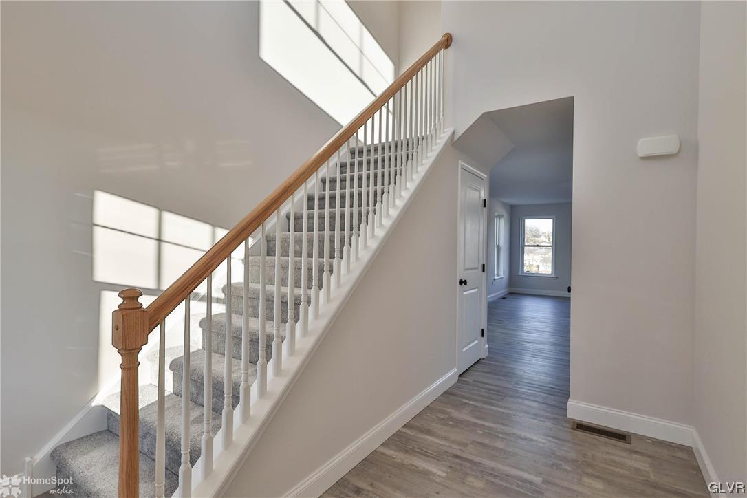 651 Sipos Drive Northampton, PA 18067 - Photo 13 of 47 a view of staircase with wooden floor and white walls