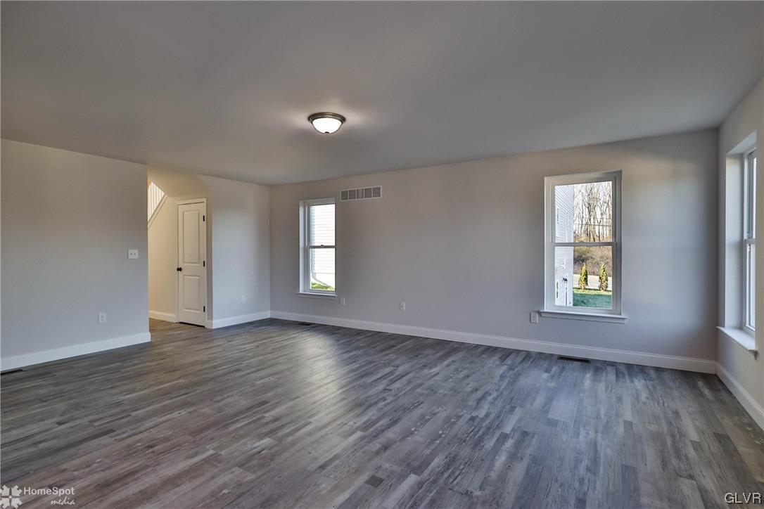 651 Sipos Drive Northampton, PA 18067 - Photo 16 of 47 an empty room with wooden floor and window