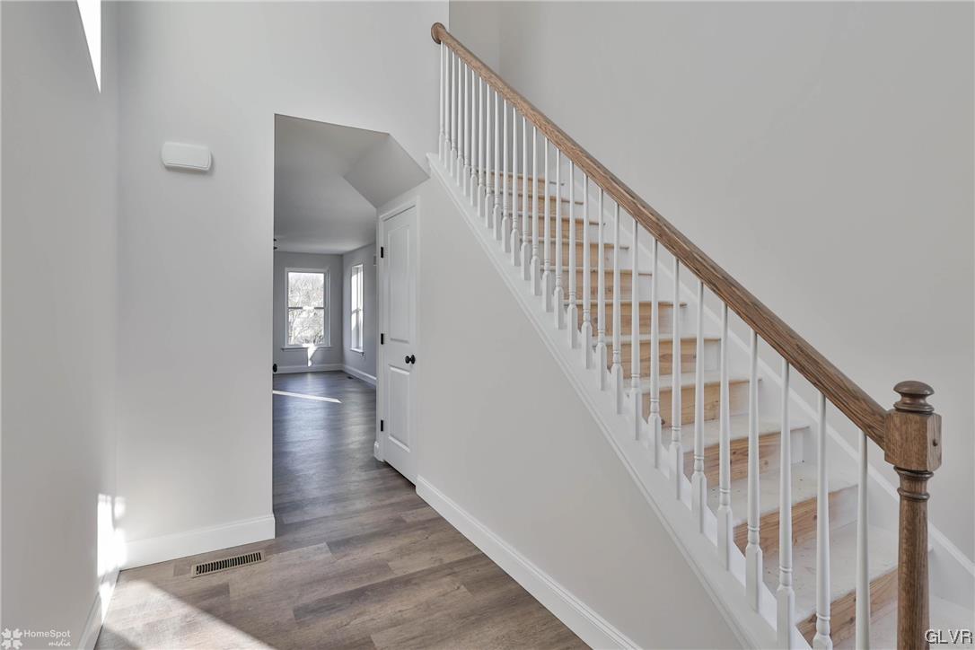 651 Sipos Drive Northampton, PA 18067 - Photo 6 of 47 a view of an entryway with wooden floor and stairs