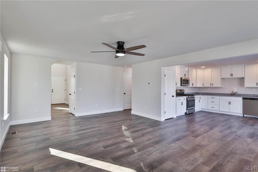 651 Sipos Drive Northampton, PA 18067 - Photo 7 of 47 a view of a kitchen with wooden floor and a ceiling fan