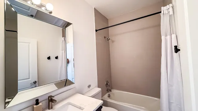 a bathroom with a bathtub and a sink