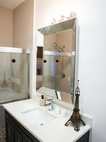 a bathroom with a sink and a mirror
