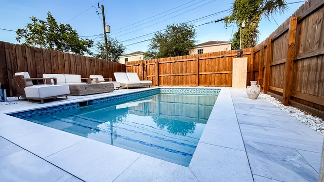 a view of a chairs and tables in the patio