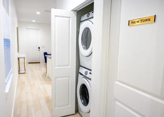 a view of a hallway with washer and dryer