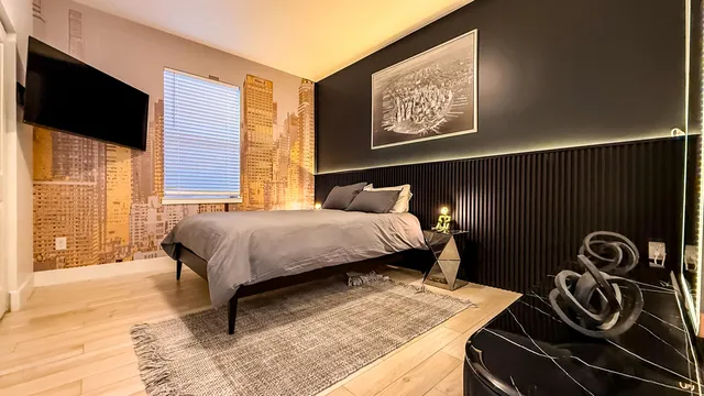 a bedroom with a bed and a window