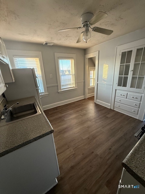 41 Alfred Street Bridgeport, CT 06605 - Photo 4 of 11 a room with wooden floor and windows