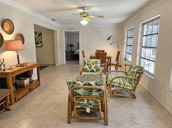a dining room with furniture and a chandelier