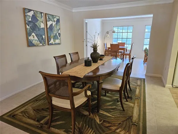 a view of a dining room with furniture and window