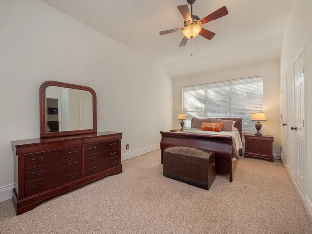 a living room with furniture and a dresser