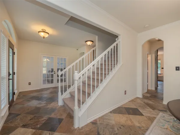 a view of a hallway with staircase